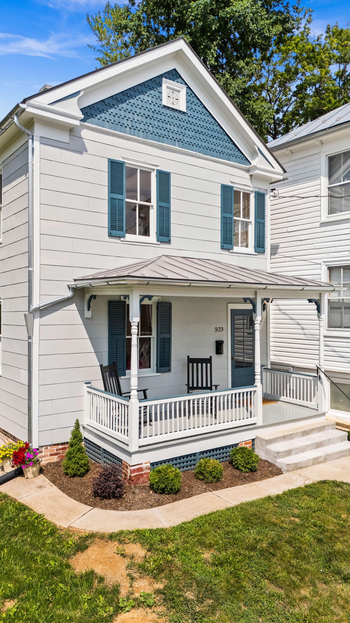 Renovated white cottage with blue trim and a stone stair, 939 West Beverley Street, Staunton