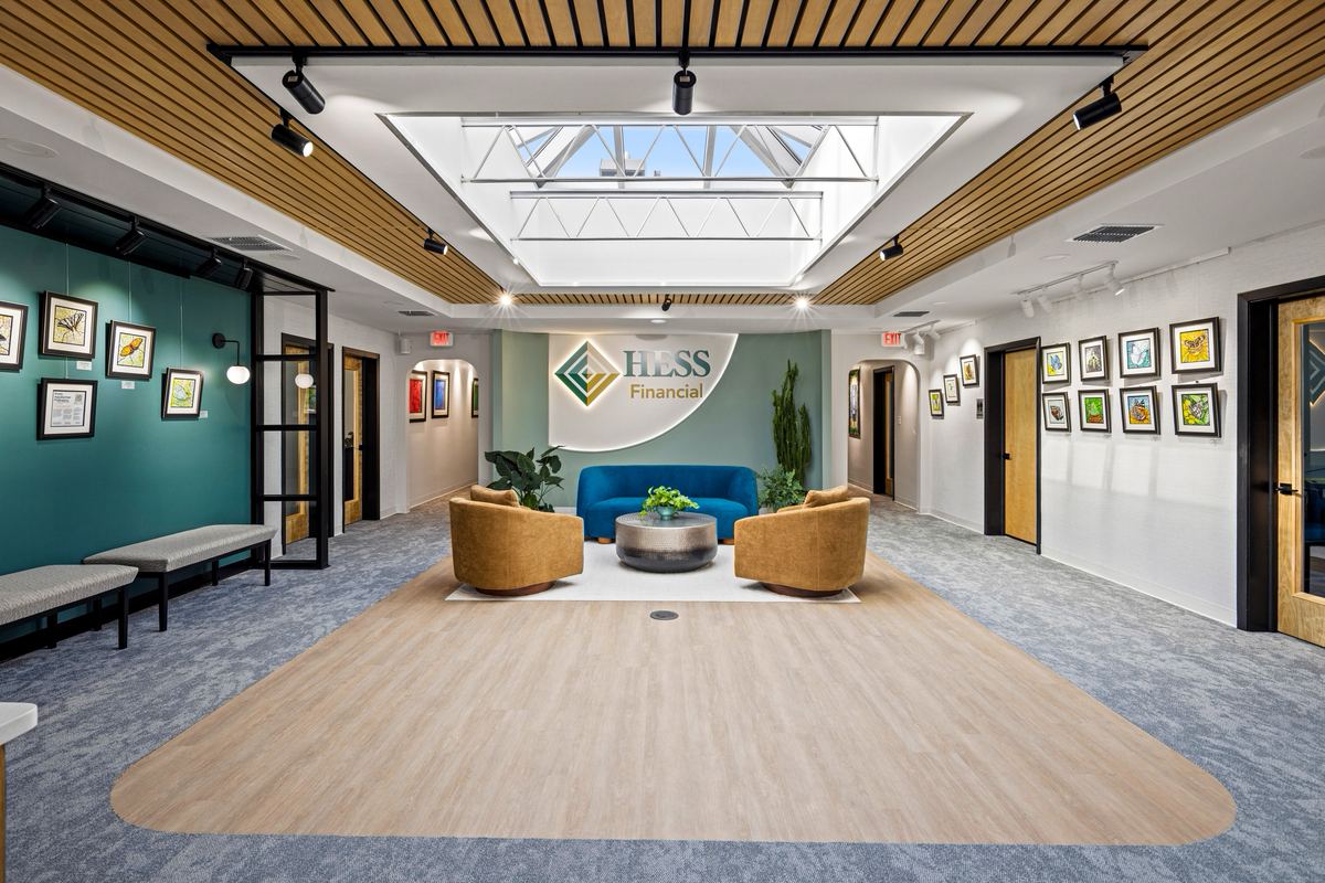 Reception under a skylight with the Hess Financial mark on the wall