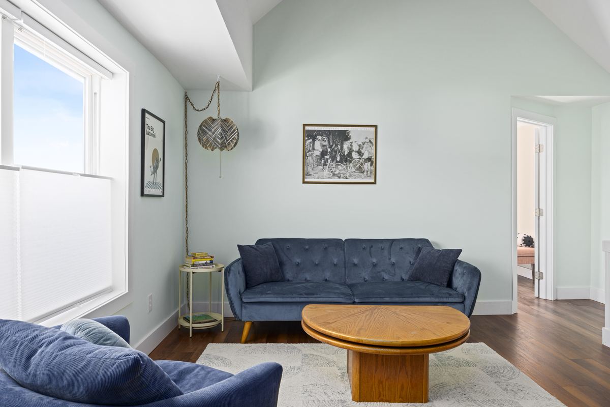 Upstairs den with a navy sofa