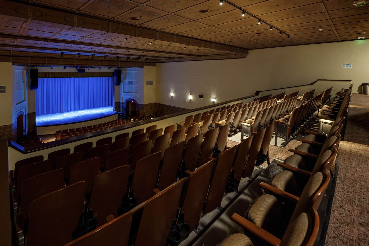 Balcony seating of the restored Millwald Theatre facing the lit stage