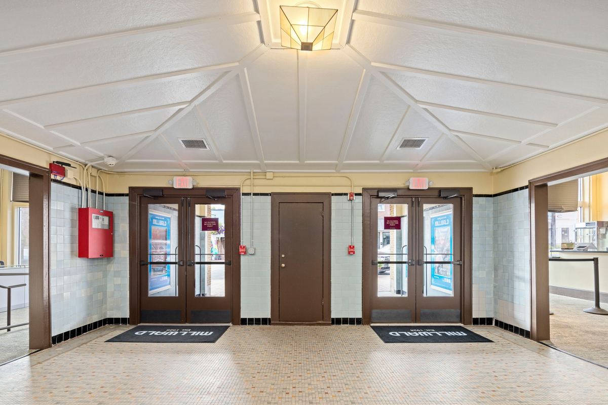 Lobby doors with terrazzo and brass