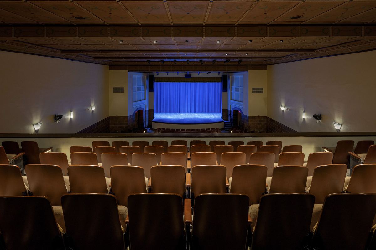 Stage and blue curtain from the back rows