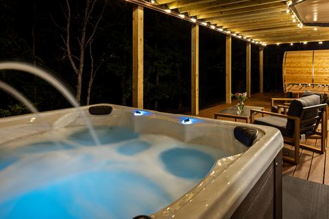 Hot tub lit at night, thumbnail size