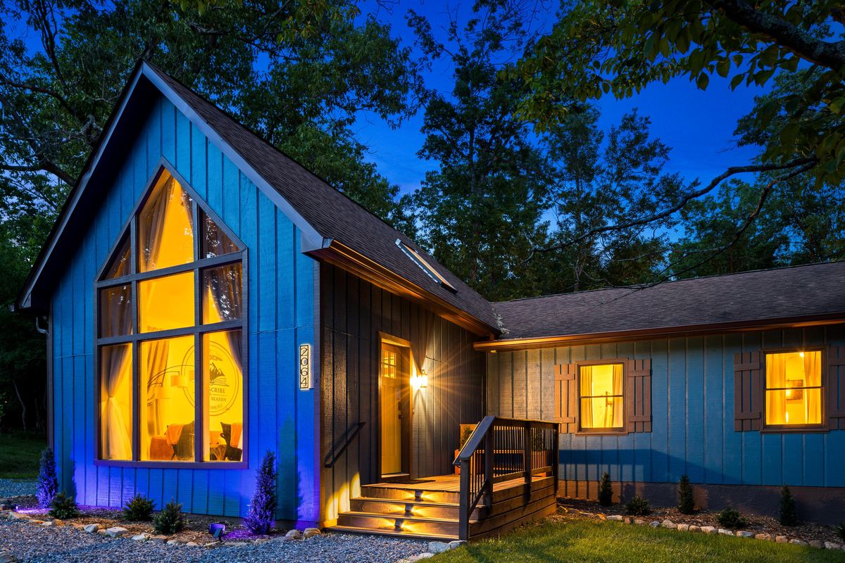 Blue A-frame cabin near Massanutten lit at twilight