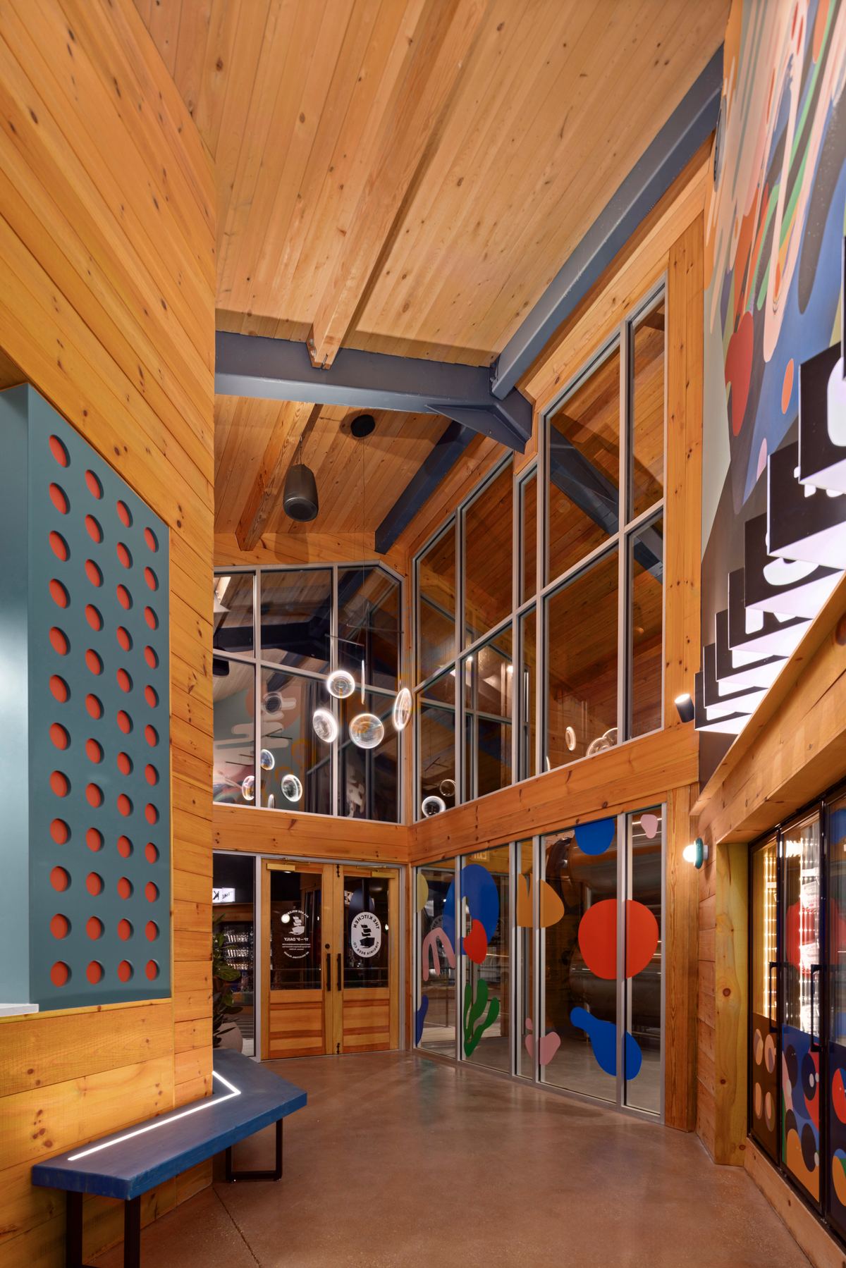 Entry vestibule with a perforated screen and the mural beyond