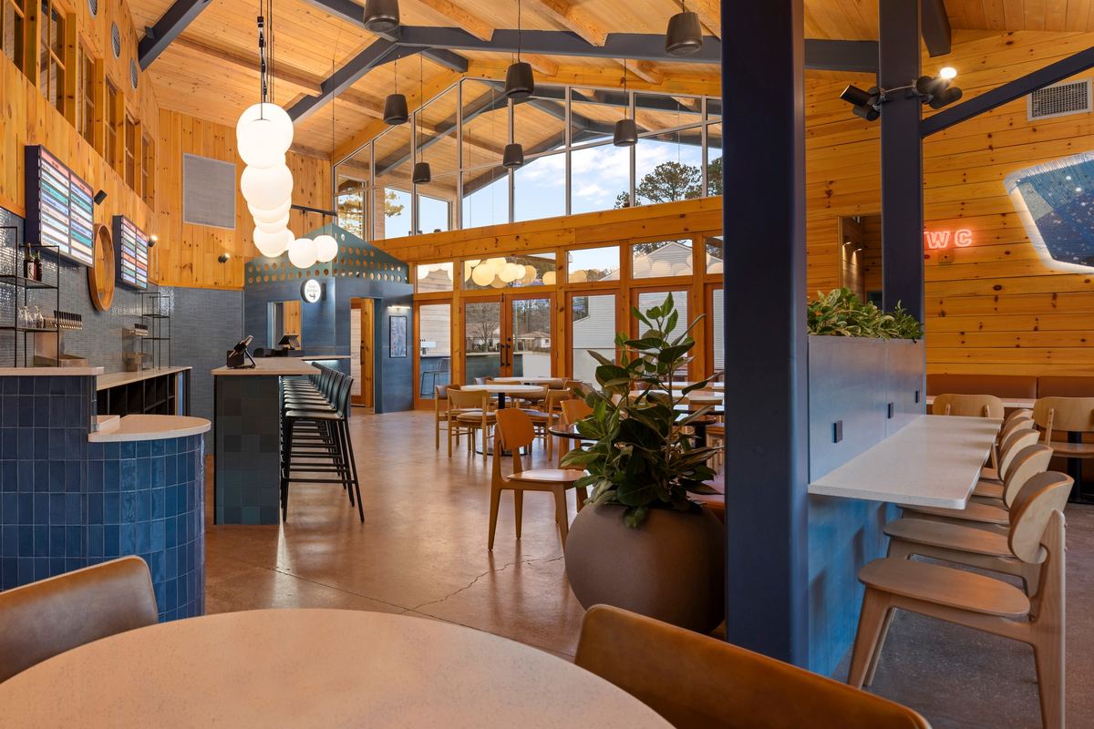 Blue tile bar and high-tops under the timber roof