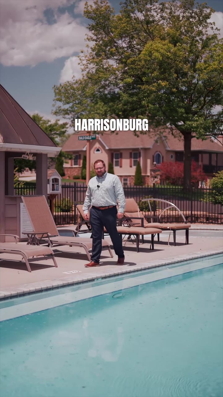 A Valley Realty agent on camera beside the community pool, 1720 Sherry Ln, Harrisonburg